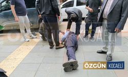 Yaşlı adam otomobilin üzerine düştü