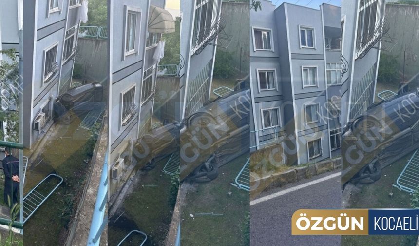 Akarca'da otomobil binanın üzerine uçtu